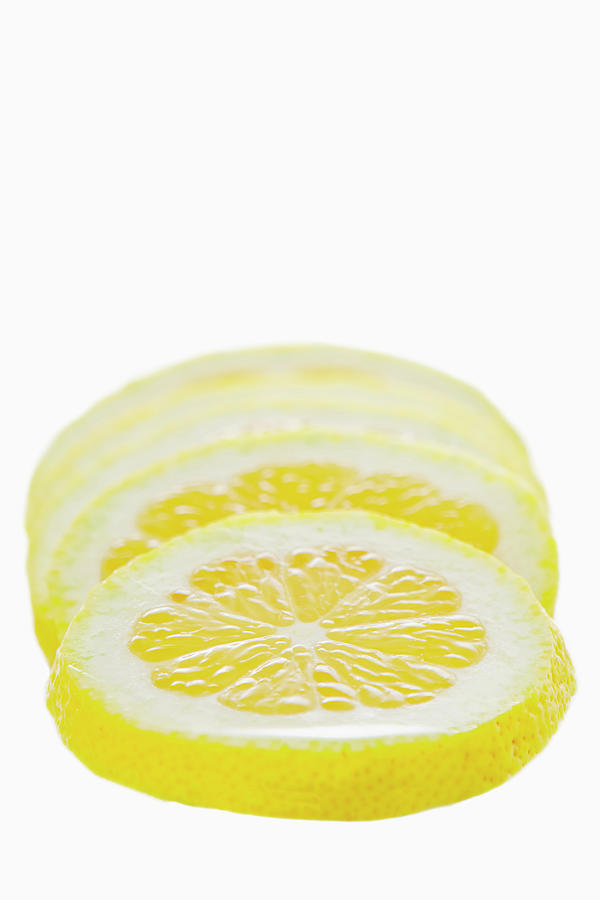 Studio Shot Of Lemon Slices Photograph by Justin Paget