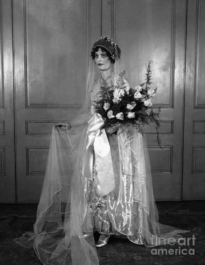 Studio Shot Of Woman In Wedding Dress Photograph by Bettmann