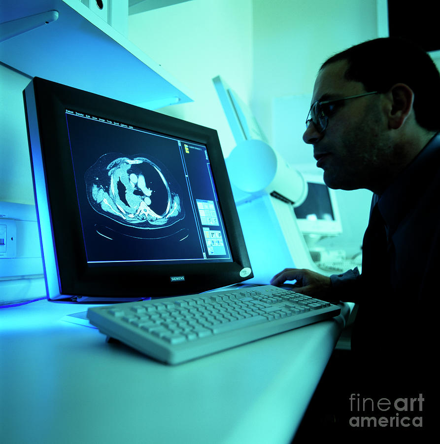 Studying Ct Scan Photograph by Colin Cuthbert/science Photo Library