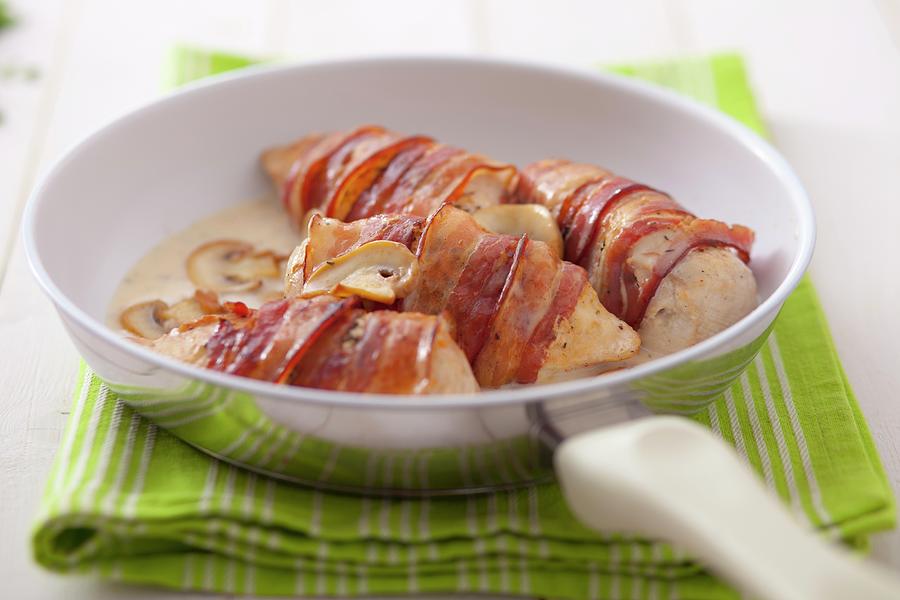 Stuffed Chicken Breast Wrapped In Bacon With Mushrooms Photograph by Studio Lipov