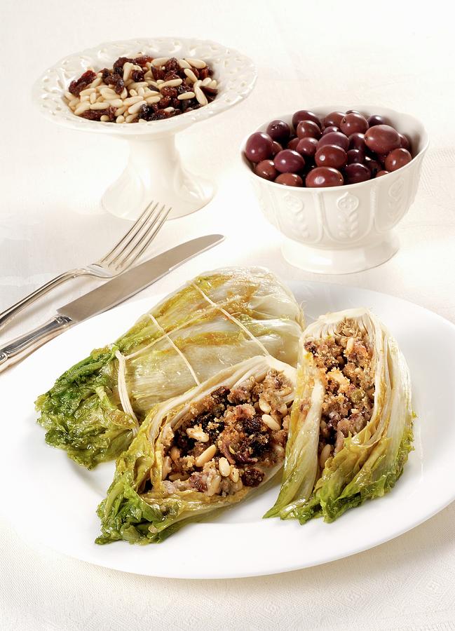 Stuffed Endives With Olives, Raisins And Pine Nuts Photograph by Franco Pizzochero