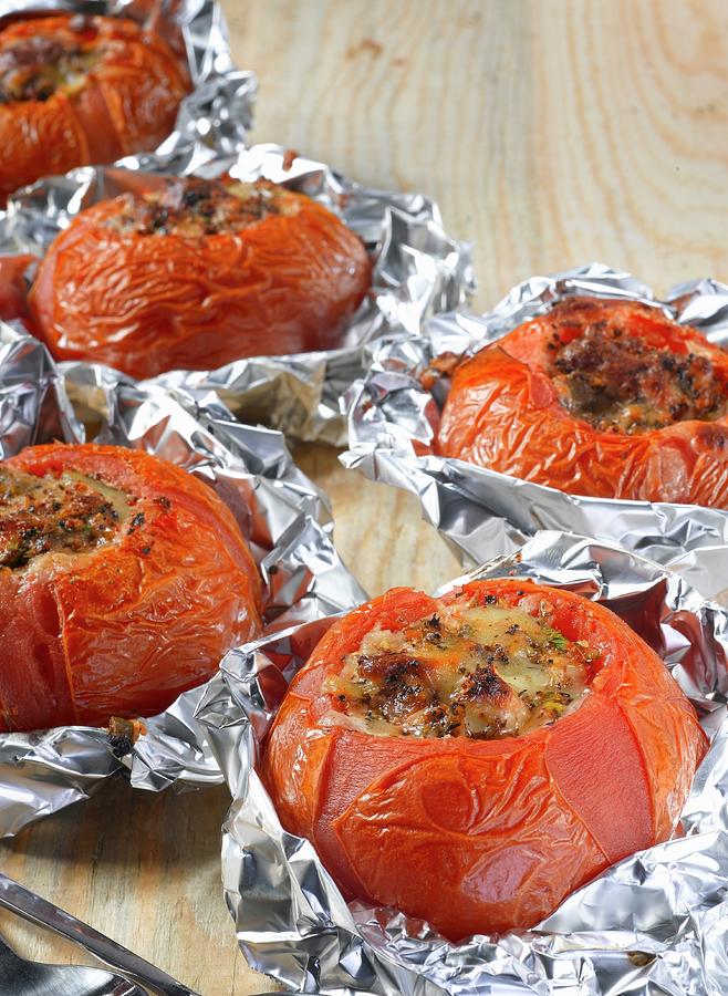 Stuffed, Grilled Tomatoes In Aluminium Foil Photograph by Glenn Moores