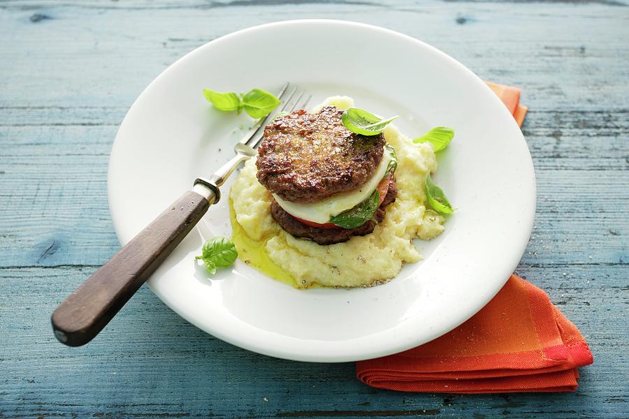 Stuffed Minced Beef Steak With Tomatoes And Mozzarella On Mashed Potatoes Photograph by Michael Wissing