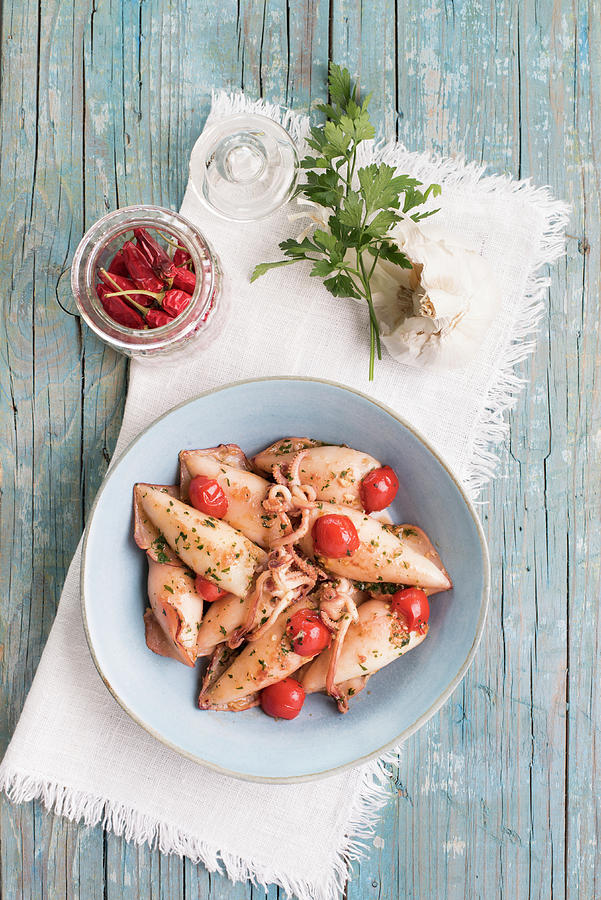 Stuffed Squid In Chili Tomato Sauce With Garlic And Parsley Photograph by Di Baldassare