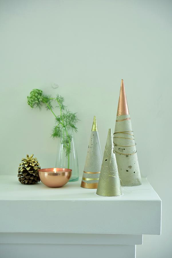 Stylised Christmas Trees Made From Concrete Cones With Metallic Paint Photograph by Great Stock!