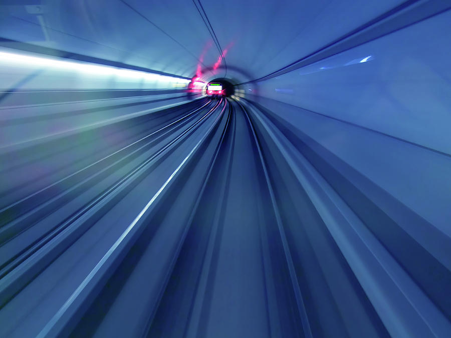 Subway Trains Rushing Through A Tunnel Photograph by Lothar Knopp