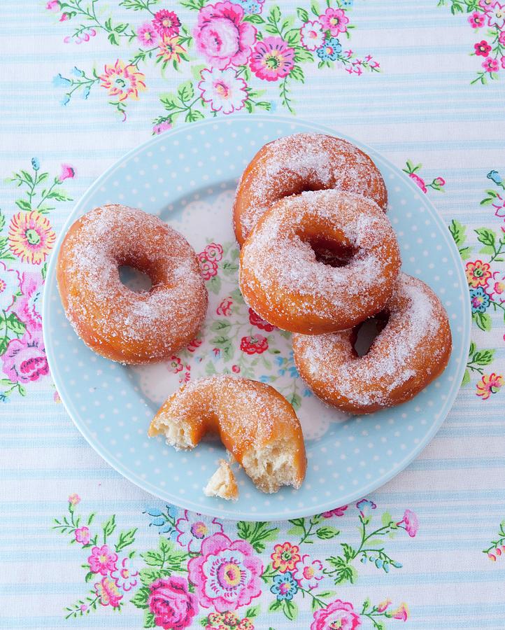 Sugared Doughnuts On A Floral-patterned Plate Photograph by Udo Einenkel