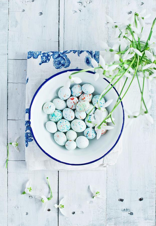 Sugared Eggs In An Enamel Bowl With Snowdrops Photograph by Dorota Indycka