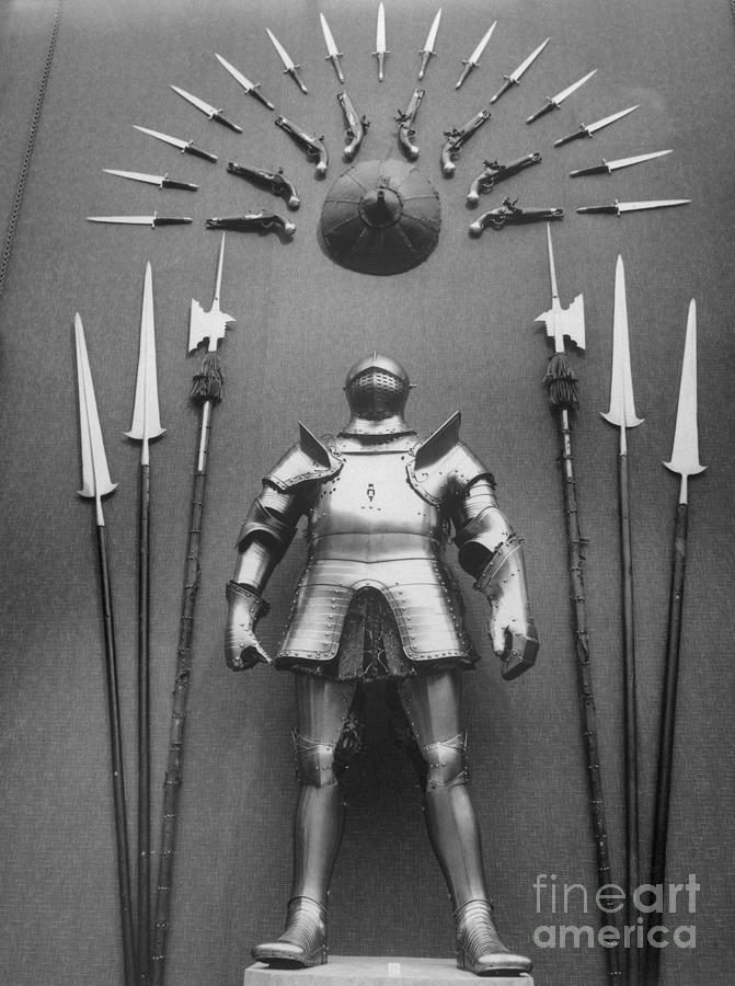 Suit Of Armor And Weapons Photograph by Bettmann