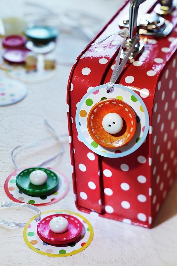Suitcase Tag Decorated With Buttons Photograph by Franziska Taube