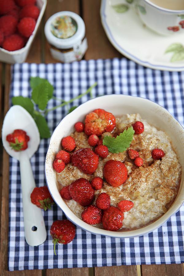 Summer Breakfast Porridge With Strawberries On A Garden Table Photograph by Dorota Ryniewicz