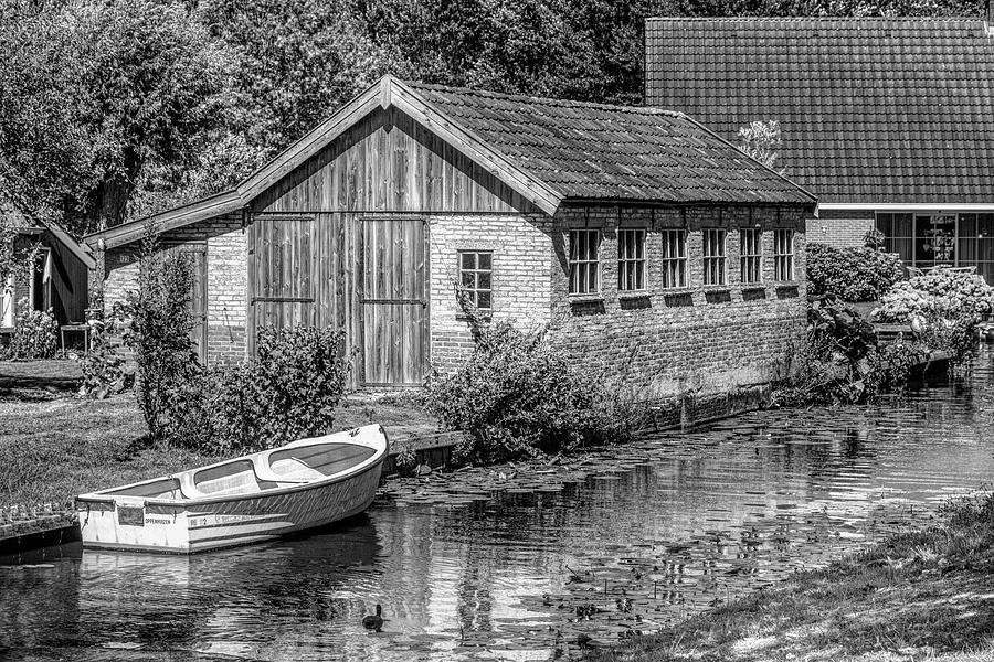 Summer Cottage on the River in Black and White Photograph by Debra and Dave Vanderlaan