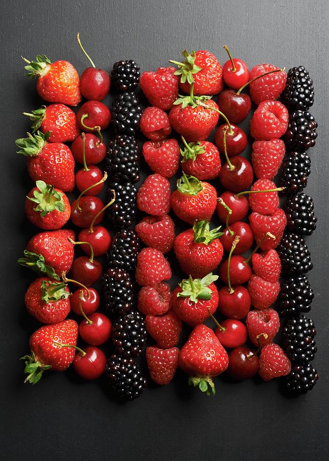 Summer Fruits On A Black Surface Photograph by Amanda Stockley