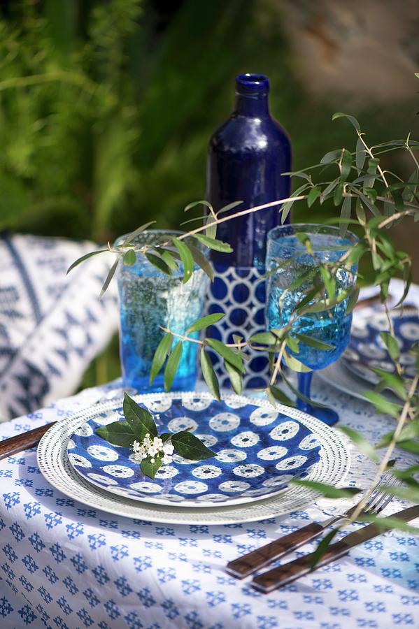 Summer Table Set With Blue And White Crockery And Twogs Photograph by Winfried Heinze