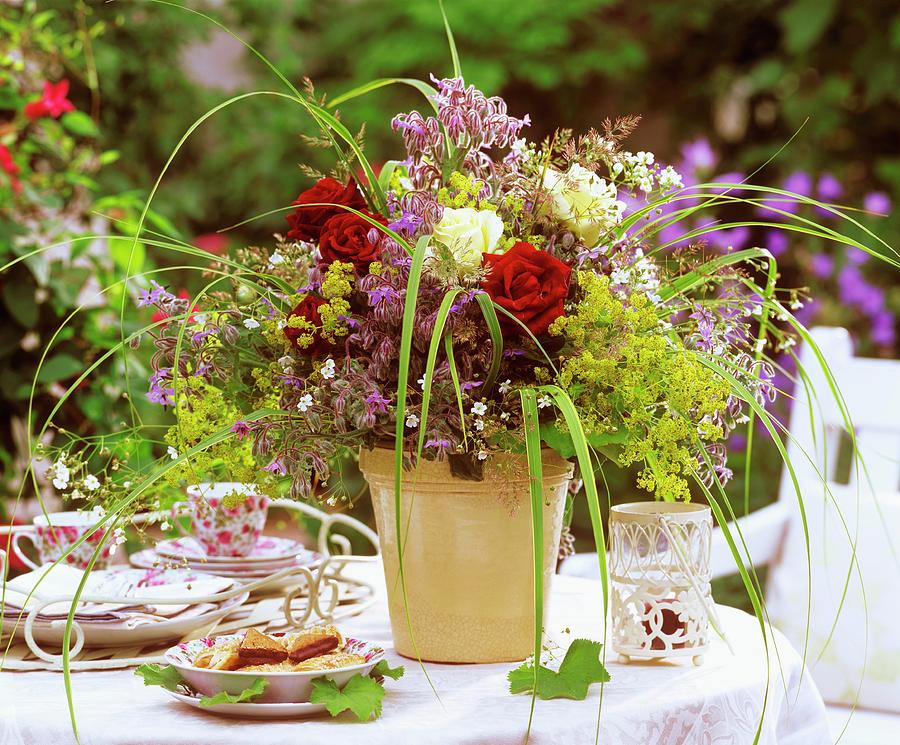 Summery Flower Arrangement On Table Laid For Coffee Photograph by Friedrich Strauss