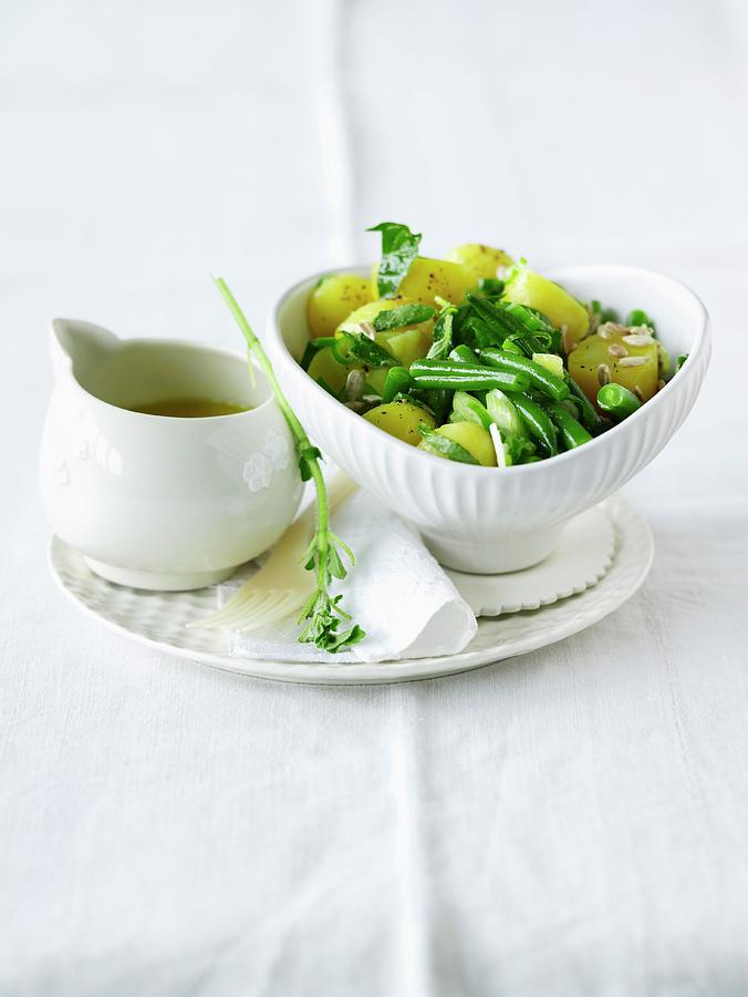 Still Life Photograph - Summery Potato Salad With Green Beans And Sunflower Seeds by Jalag / Janne Peters