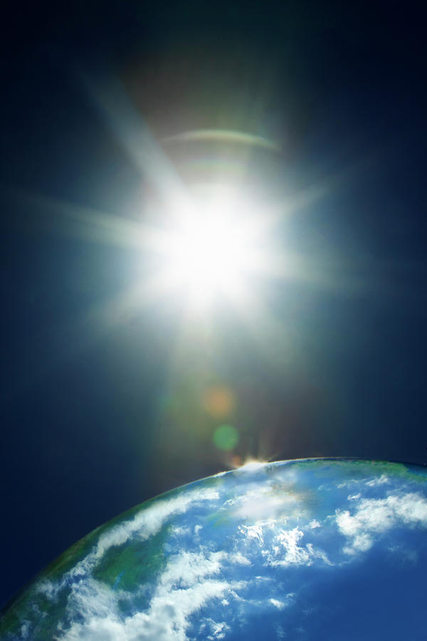 Sun & Earth Photograph by Yuji Sakai Sun & Earth Photograph by Yuji Sakai