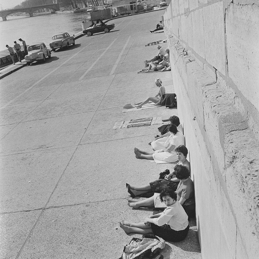 Sun Bathing On The Seine Rivers Quays Photograph by Keystone-france