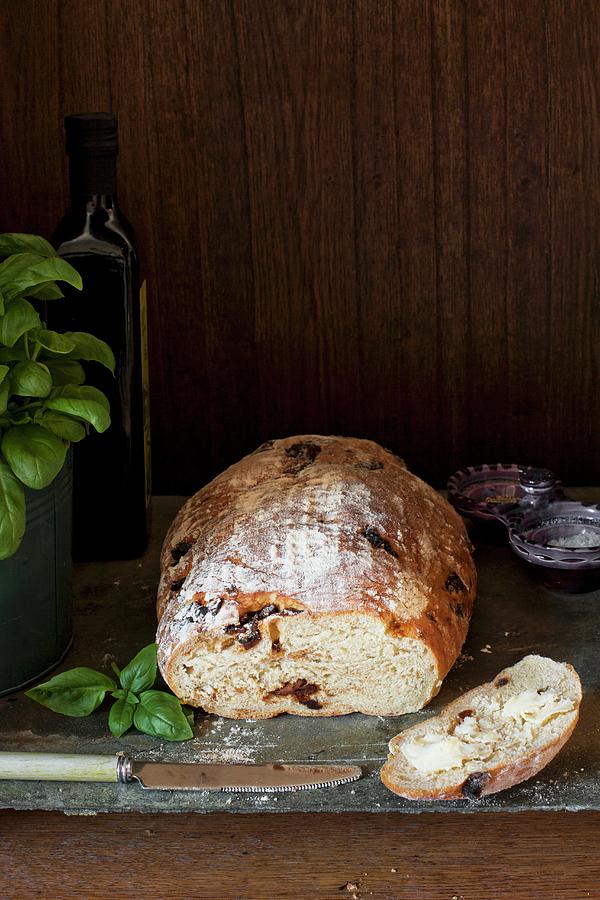 Sun Dried Tomato And Basil Bread With A Buttered Slice Photograph by Magdalena Hendey