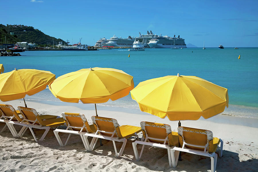 Sun Loungers On Beach With Cruise Ship Photograph by Onfilm