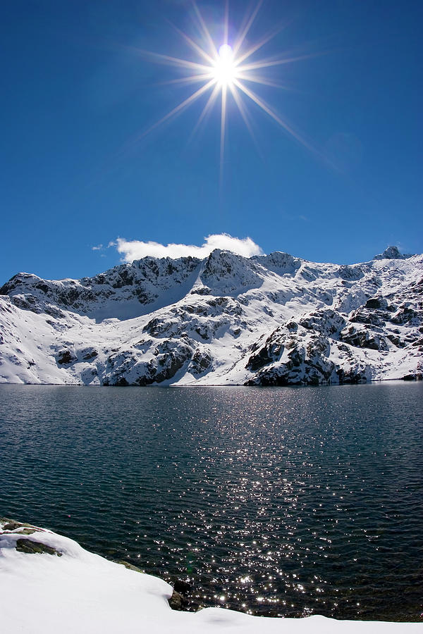 Sun Over Snowy Mountain By Lightpix