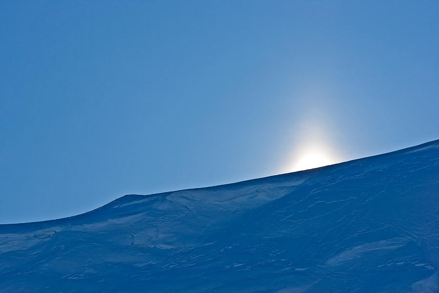 Sun Peeking Over Snow Covered Mountain Photograph by Sindre Ellingsen