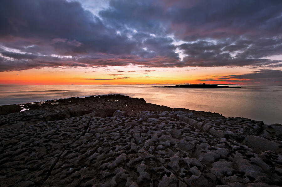 Sun Setting Over Beach Rock Formations Photograph by George Karbus Photography