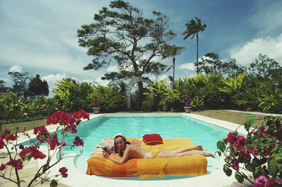 Sunbathing In Barbados Photograph by Slim Aarons