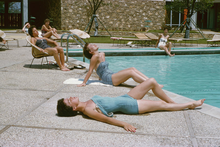 Dallas Photograph - sunbathing Poolside by Peter Stackpole