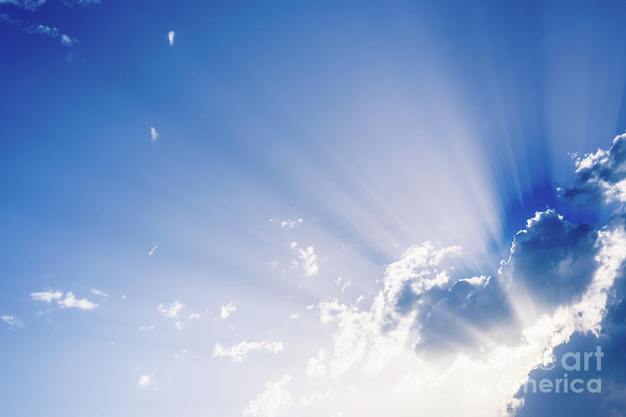 Sunbeams Rising From A Large Cloud In Intense Blue Sky On A Summer Afternoon Photograph