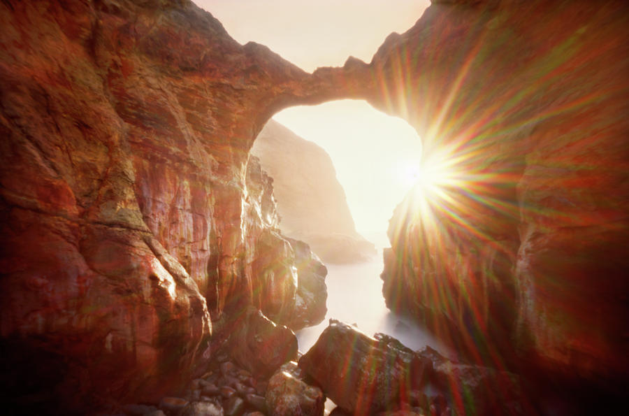 Sunflare Through Arch Of Keyhole Photograph by Zeb Andrews