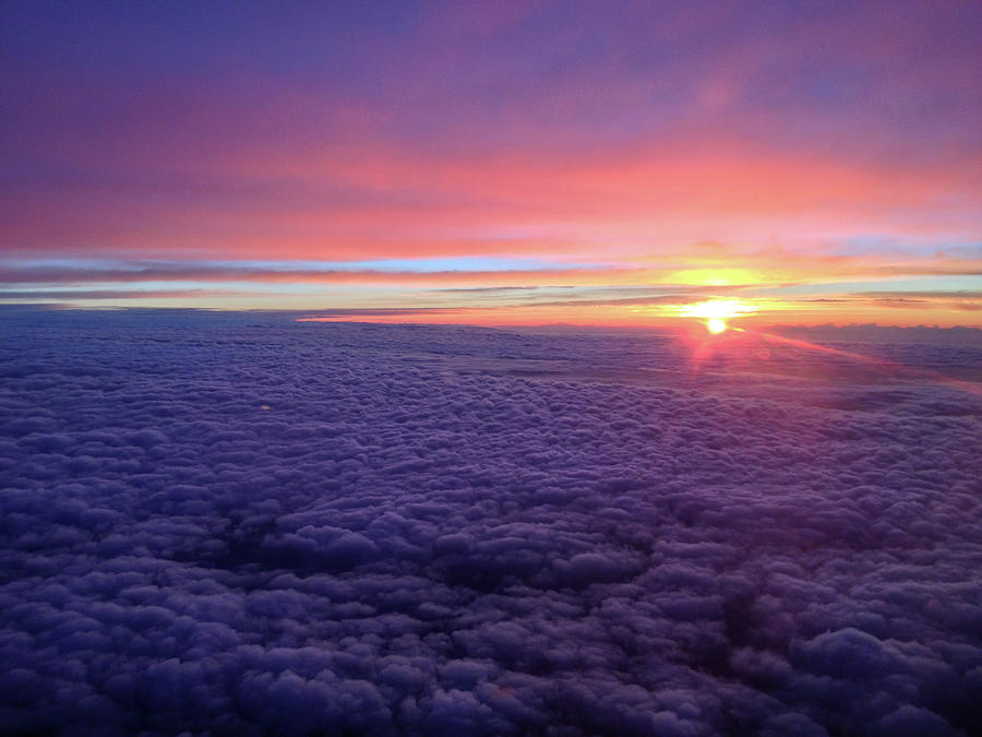 Sunrise Above the Clouds Photograph by Mark Duehmig