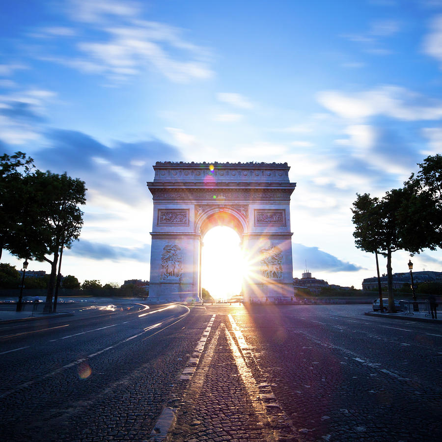Sunrise At The Arc De Triomphe Photograph by Espiegle