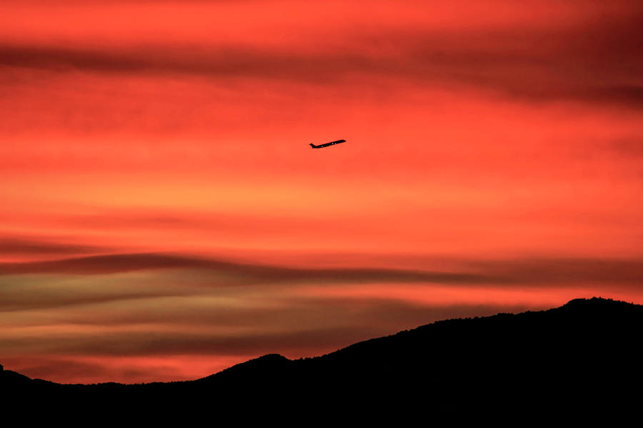 Airplane Photograph - Sunrise Departure by Donna Kennedy