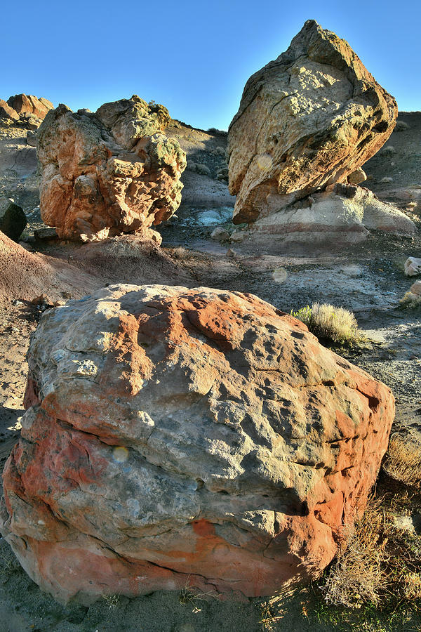Sunrise on Boulders of Bentonite Site Photograph by Ray Mathis