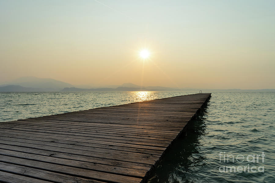 Sunrise on Lake Garda Photograph by Ann Garrett