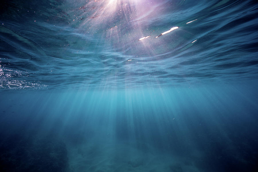 Sunrise Piercing Through Clear Blue Waters In Oahu, Hawaii Photograph ...