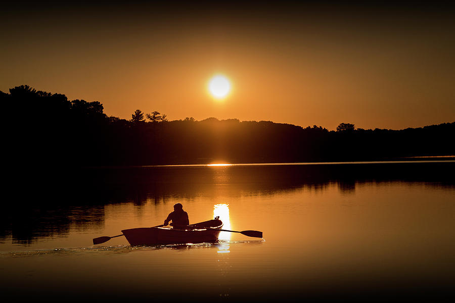 Sunrise with Rowboat crossing Stony Lake Photograph by Randall Nyhof
