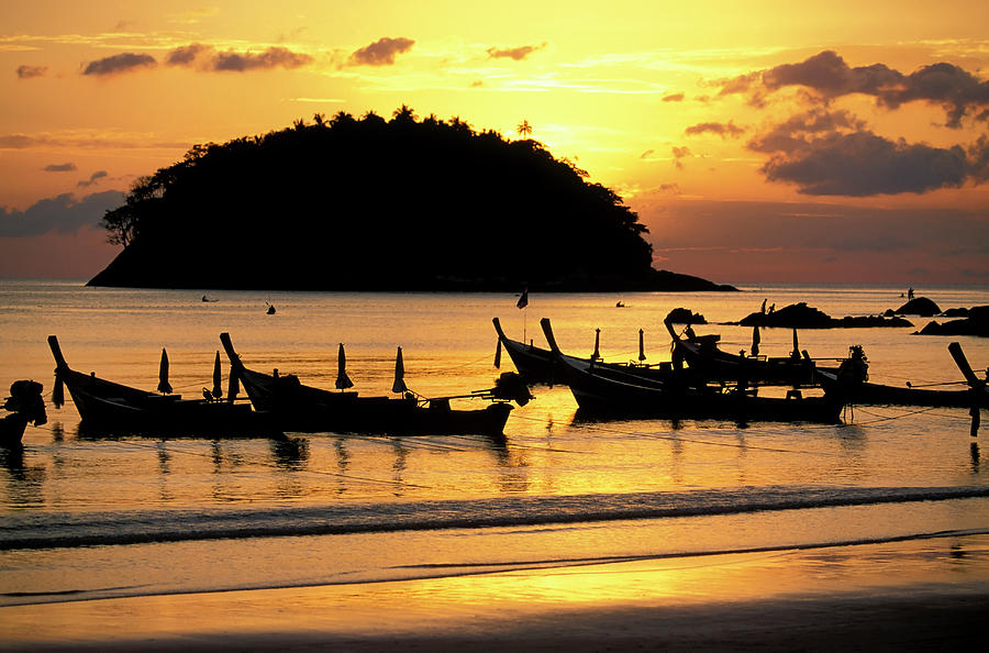 Sunset At Phuket Beach With Silhouettes Photograph by Laughingmango