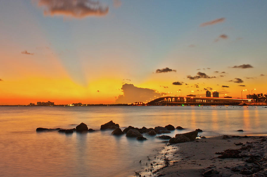 Sunset behind the Rickenbacker Causeway on Biscayn Bay Photograph by Edgar Estrada