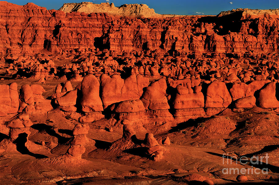 Sunset Light Turns The Hoodoos Blood Red In Goblin Valley State Park Utah Photograph by Dave Welling