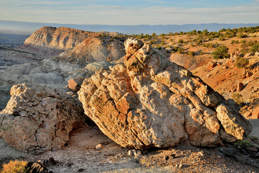 Sunset on Boulders of Little Park Road Bentonite Site Photograph by Ray Mathis