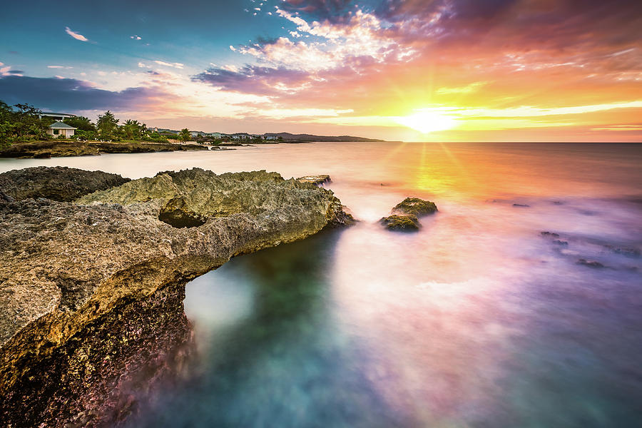 Sunset over a tropical rocky beach Photograph by Mihai Andritoiu