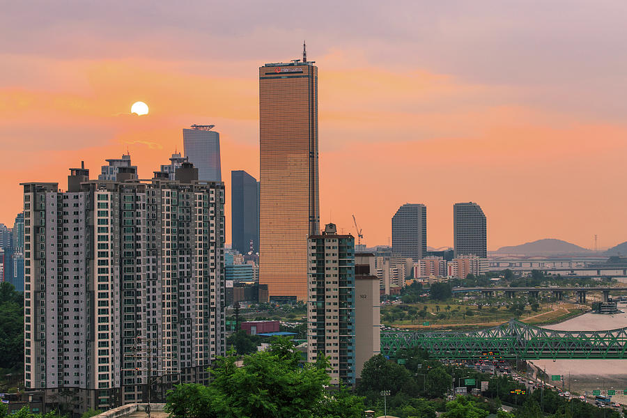 Sunset Over Buildings In City Photograph by Sungjin Kim