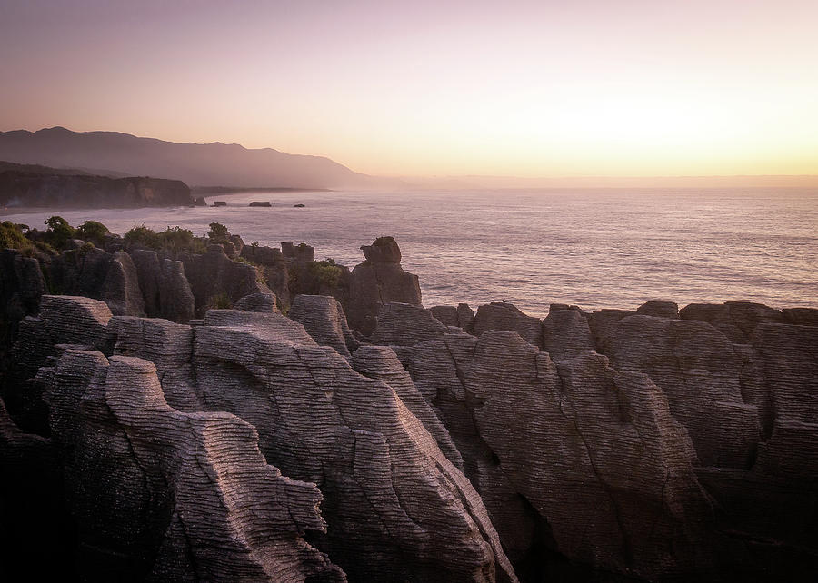 Colorful Coastal Sunset Over Pancake Rocks In New Zealand Photograph by Peter Kolejak