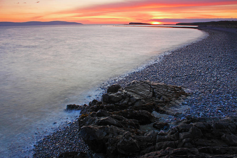 Sunset Over Salthill Beach And Galway Photograph by Trish Punch / Design Pics