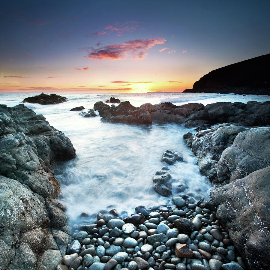 Sunset Over Sea With Pebbles In Photograph by John B. Mueller Photography