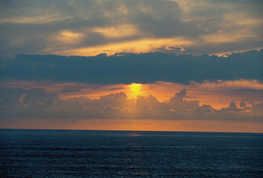 Sunset Over The Ocean Photograph by Medioimages/photodisc