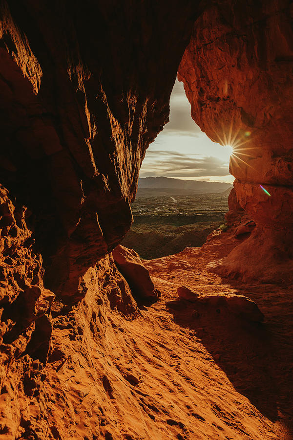 Sunset View Over St. George Utah From Inside An Orange Cave Photograph by Cavan Images