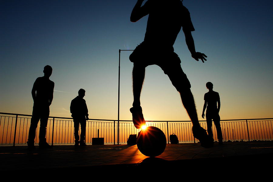 Sunset With Football Photograph by Rolfo